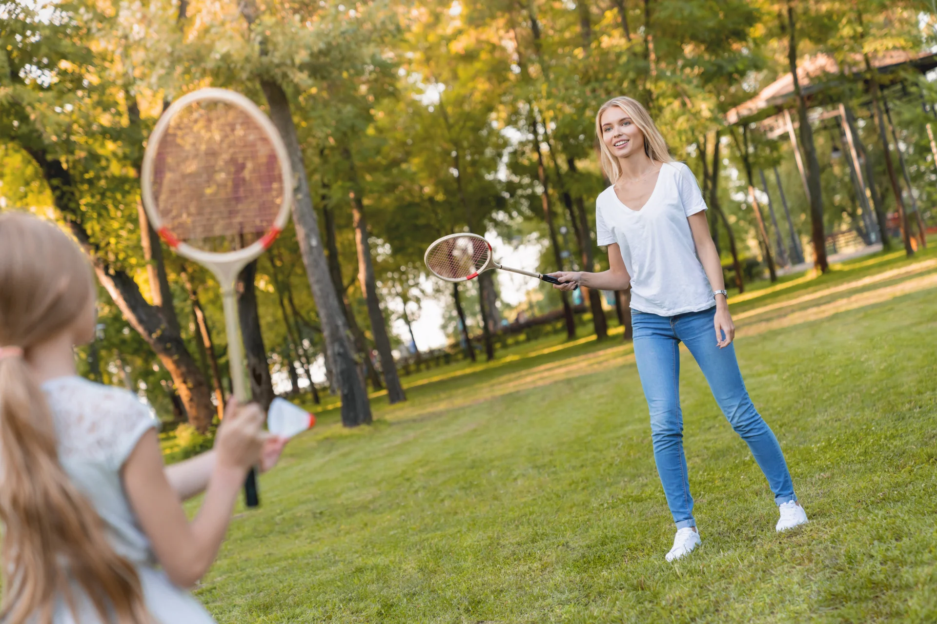 two girls playing badminton